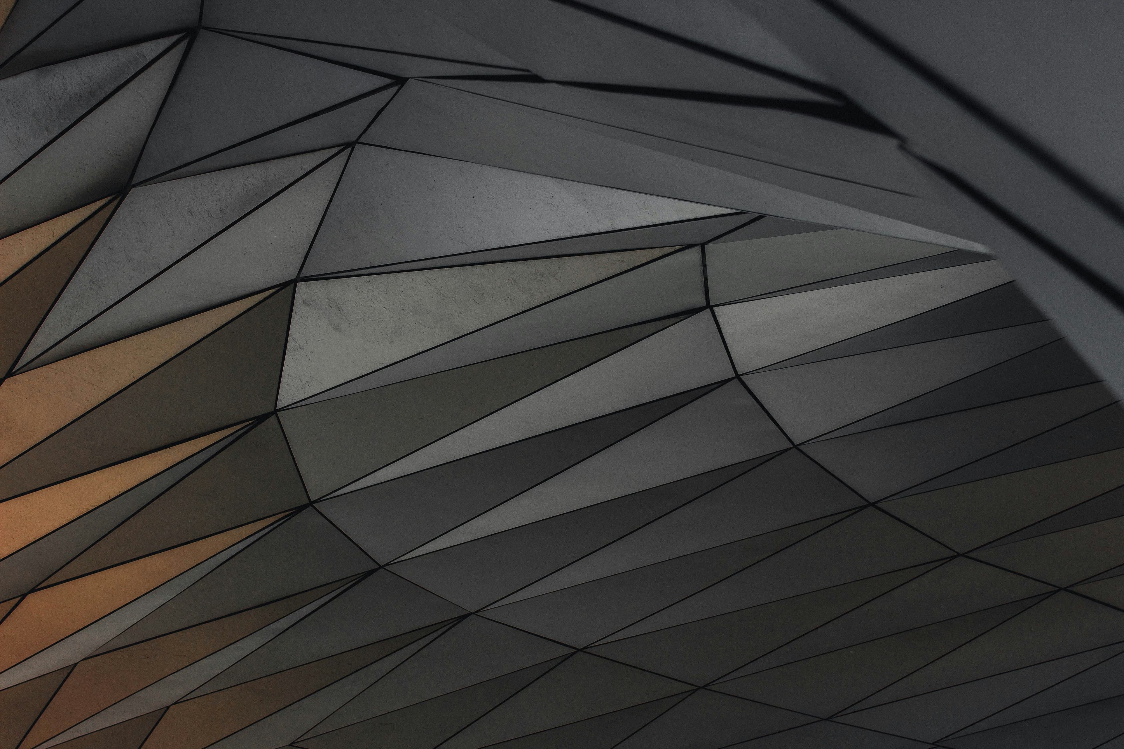 geometric shapes are arranged in a dark composition